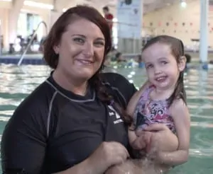 swim instructor with child